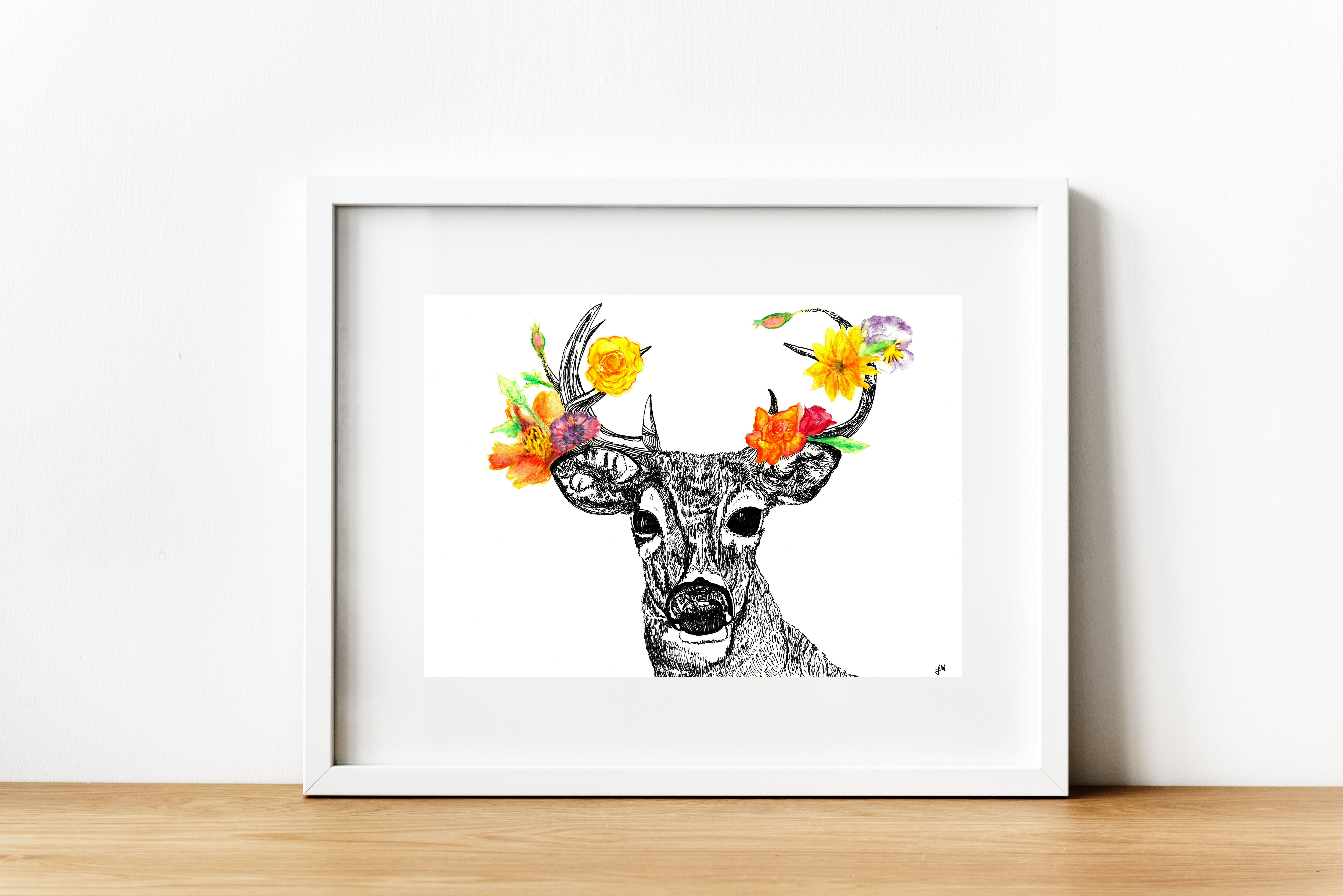 A buck deer drawn in black pen sports antlers with bright yellow, orange and purple flowers.